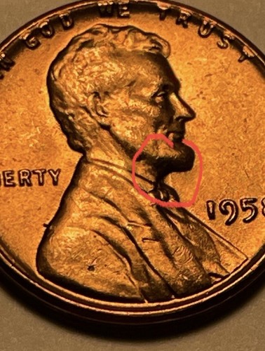 1958 wheat penny off-center strike showing Lincoln design shifted with visible blank crescent and full date